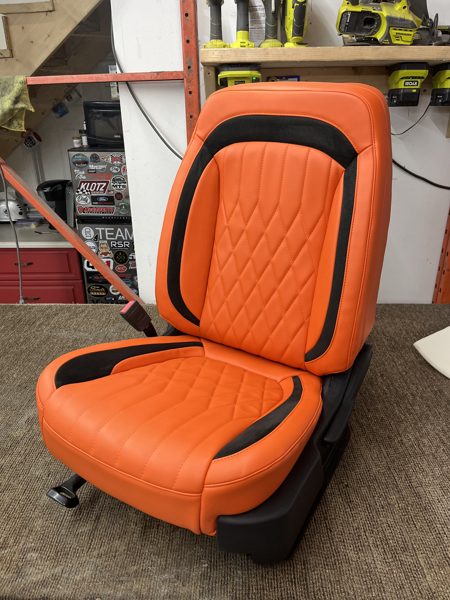 Orange upholstered bucket seat