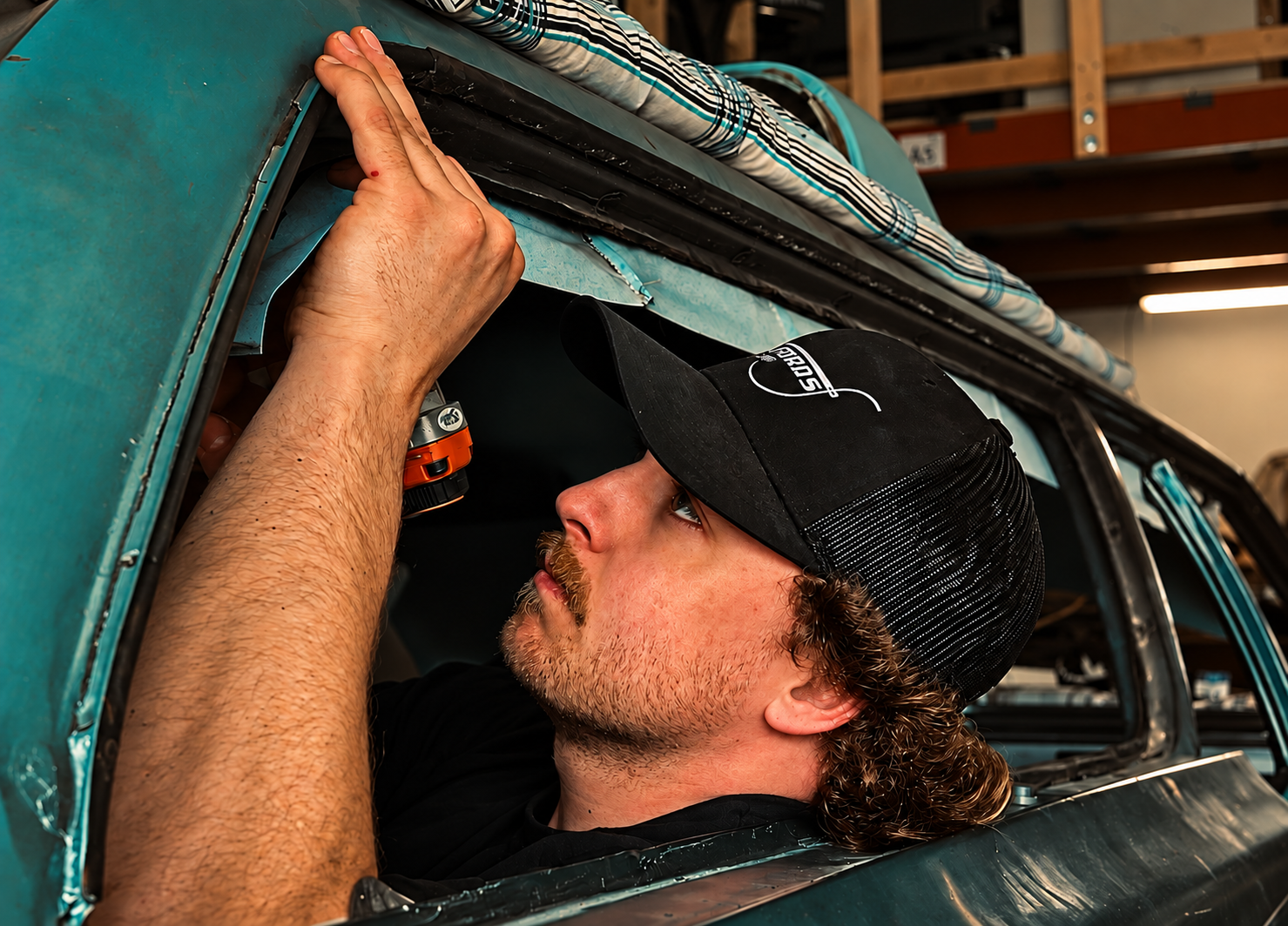 Hands-on work on a classic car at Mugfords Trim Shop